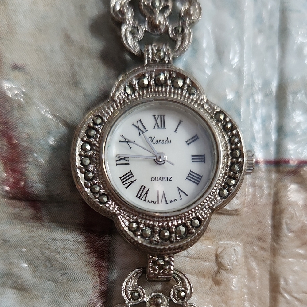 Silver Tone Pendant Watch with Floral Frame and Intricate Filigree